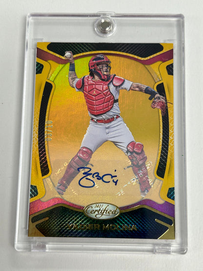 Baseball trading card of Yadier Molina in red, showcasing Panini Certified Mirror Gold