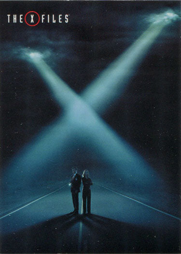 X-shaped beams of light in night sky above two figures on road for X-Files trading cards