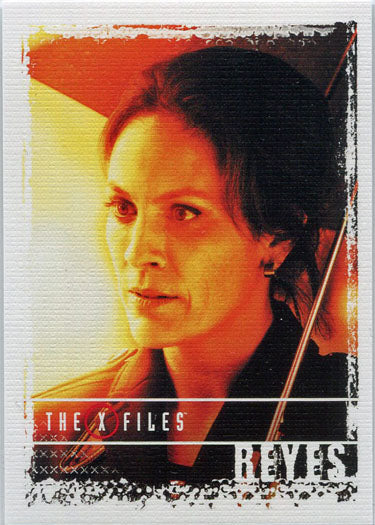 Trading card of Reyes from The X Files, featuring a woman with dark hair on a colorful background