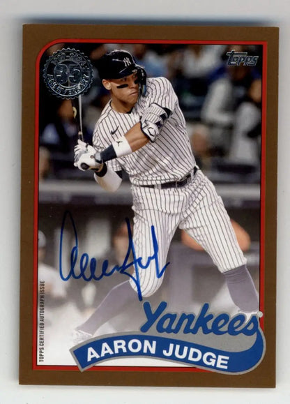 Signed Aaron Judge trading card in pinstripe uniform, Topps Gold Auto 09/50