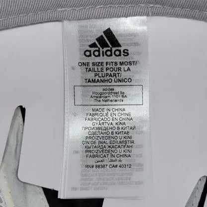 White Adidas clothing label with ’one size fits most’ for Blues Mascot Louie Strapback Cap