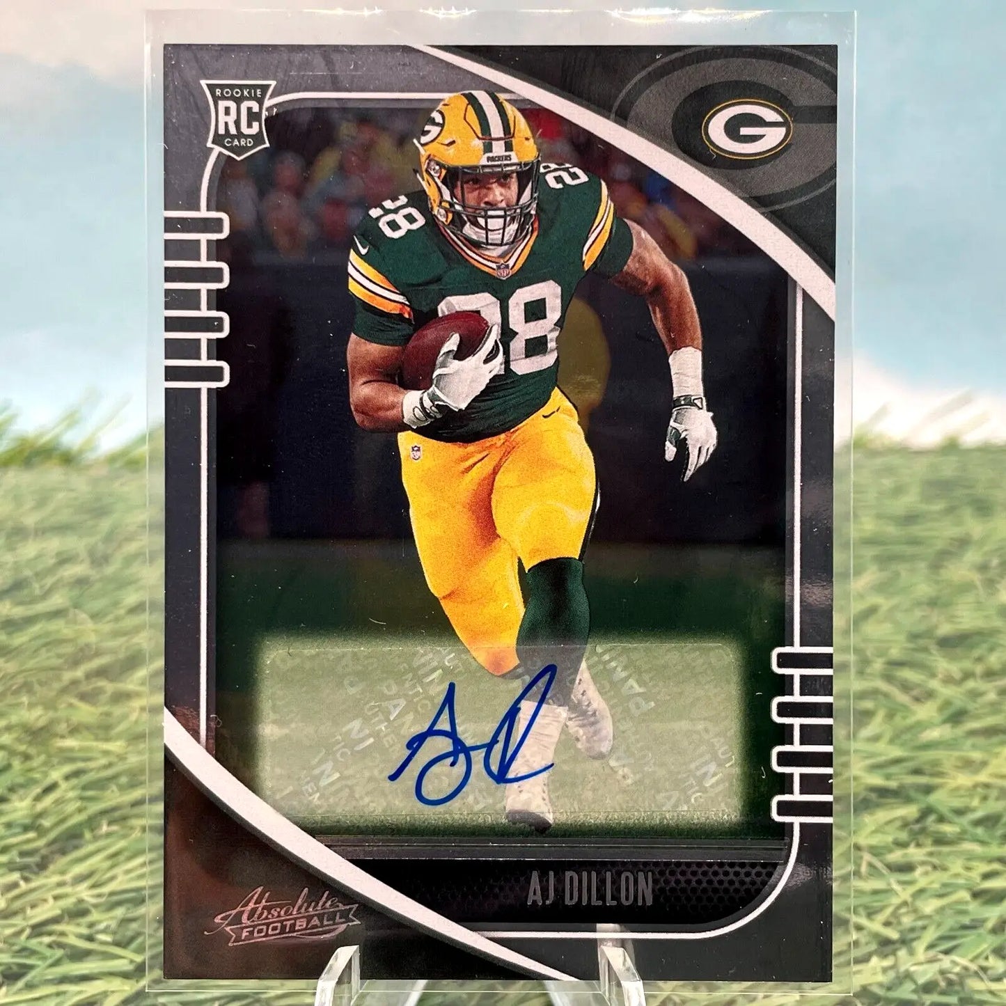 Signed AJ Dillon Rookie Auto football card features Green Bay Packers team colors