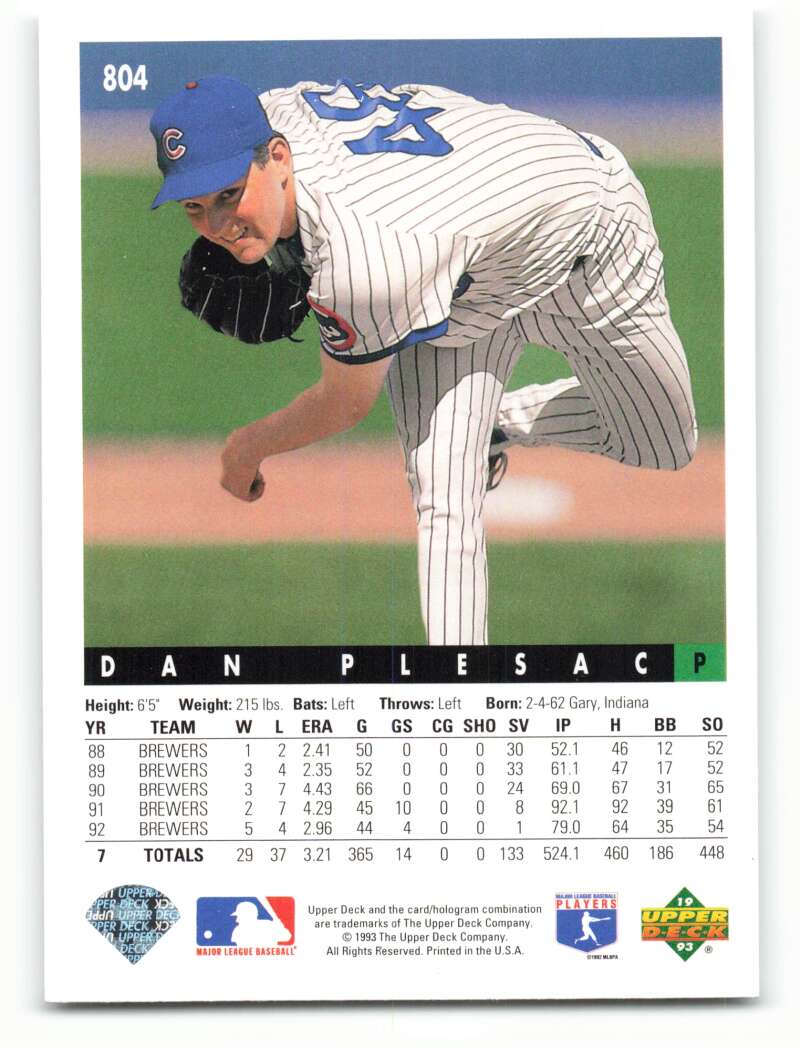 Dan Plesac in pinstriped uniform during pitch delivery on Chicago Cubs baseball card