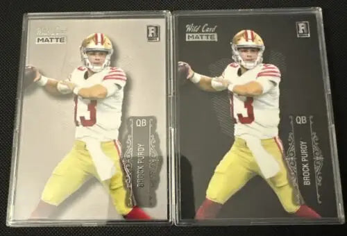 Two Brock Purdy Wild Card Matte Rookie football cards in a 49ers card set