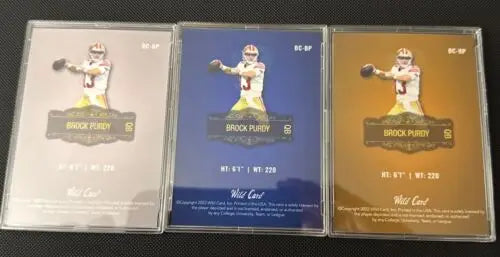 Three Brock Purdy Wild Card Rookie cards in a collectible lot display