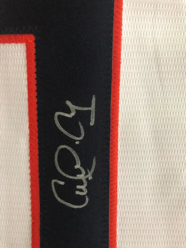 Carlos Correa autographed Houston Astros jersey with silver signature on dark surface