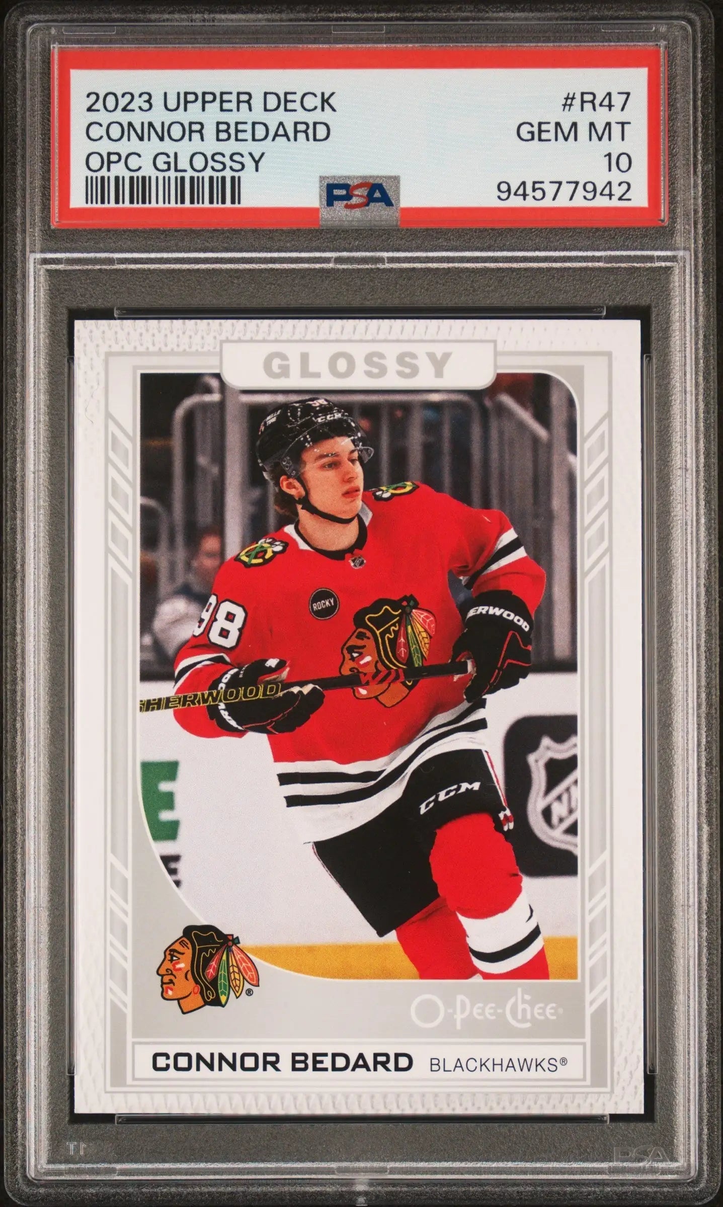 PSA-graded Connor Bedard 2023 Upper Deck hockey card in glossy red Blackhawks jersey