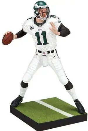 Football player figurine in throwing stance wearing Philadelphia Eagles Carson Wentz uniform