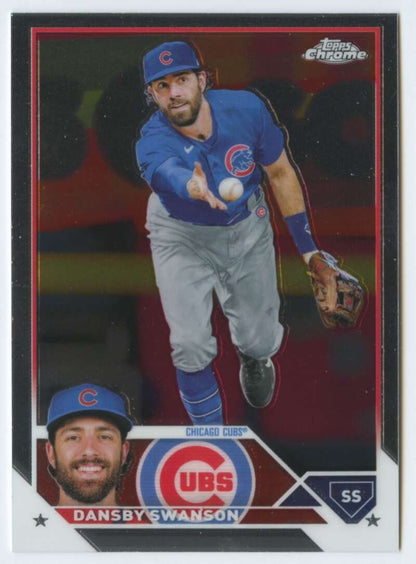 2023 Topps Chrome Dansby Swanson Chicago Cubs card showing fielding motion in blue uniform