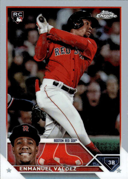 Baseball card of Enmanuel Valdez in Boston Red Sox red uniform swinging bat