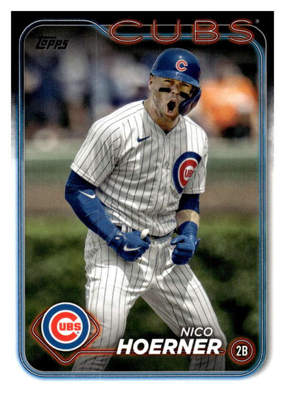 Chicago Cubs baseball card of Nico Hoerner celebrating in pinstriped uniform