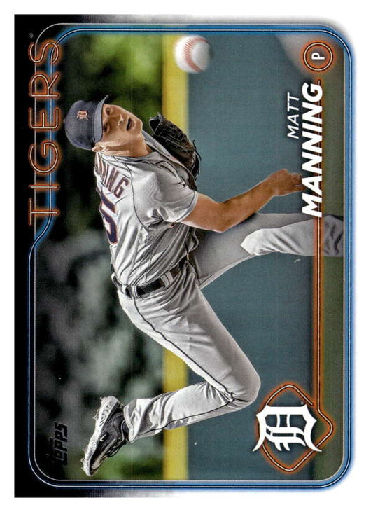 Matt Manning leaps to catch a ball in a white uniform on Detroit Tigers baseball card