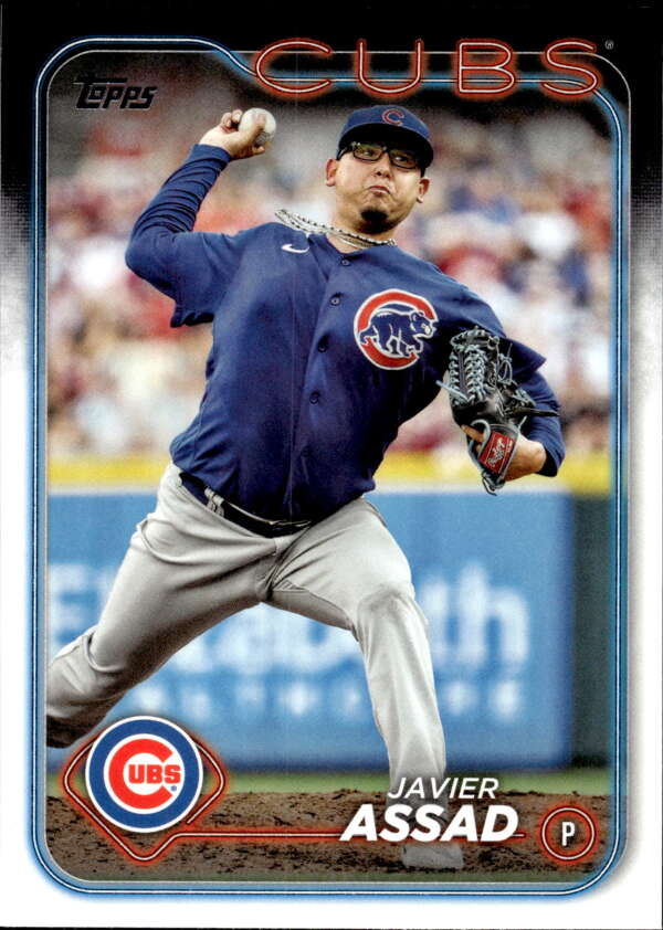 Chicago Cubs baseball card of Javier Assad mid-throw in blue jersey