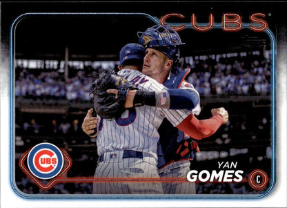 Yan Gomes of the Chicago Cubs swinging a bat on a 2024 Topps baseball card