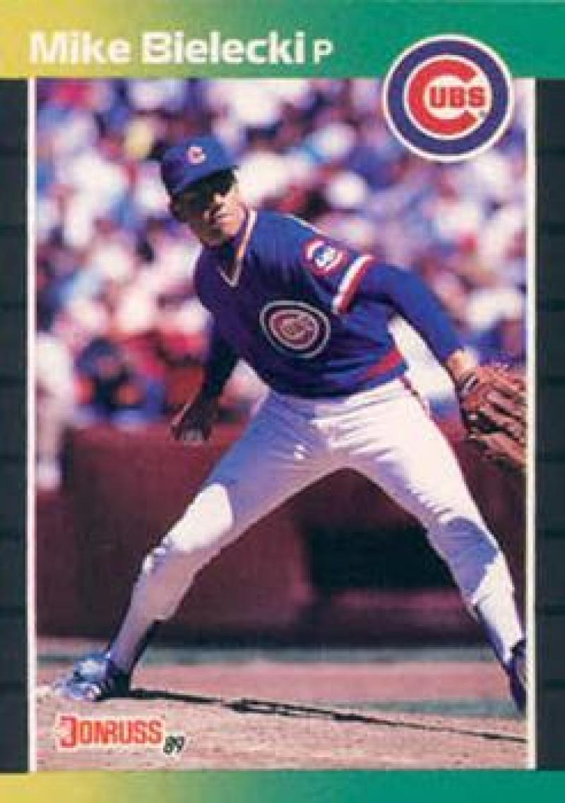 Baseball card of Mike Bielecki mid-delivery in Chicago Cubs blue and white uniform