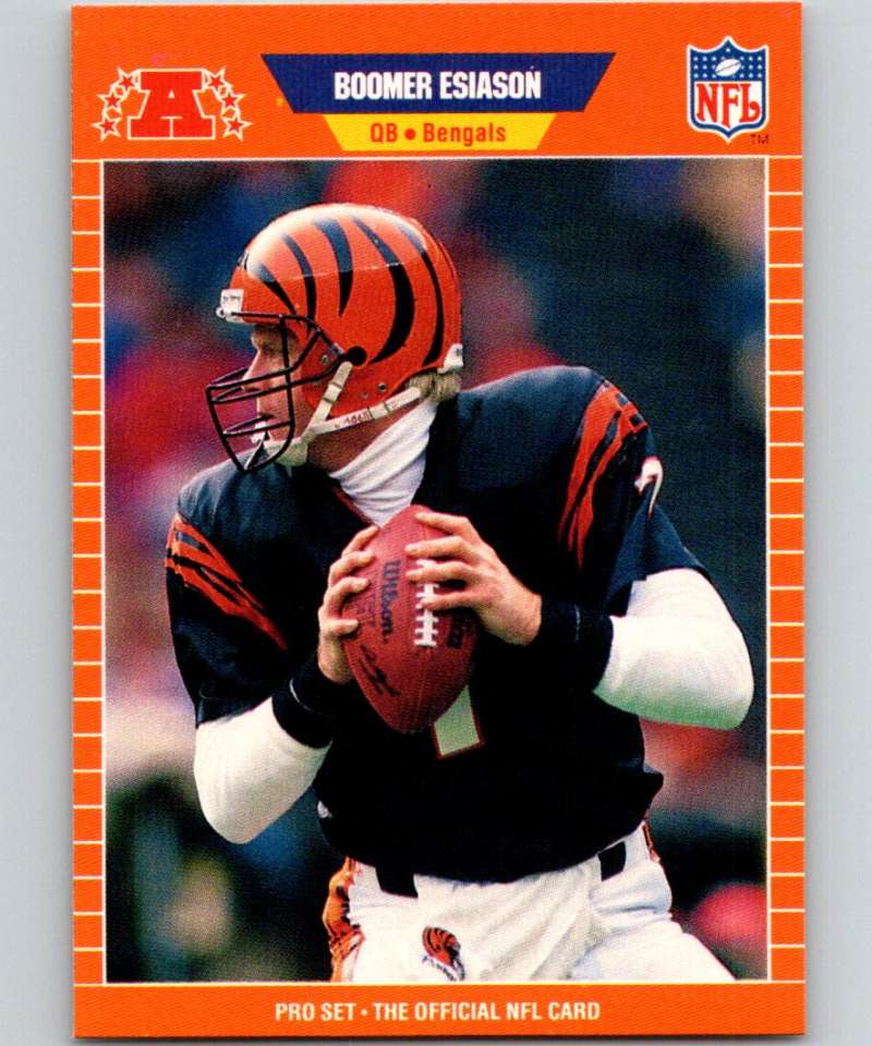 NFL trading card of Boomer Esiason in Cincinnati Bengals uniform holding football