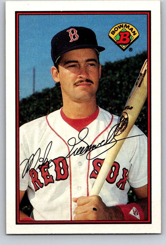 Baseball card of Mike Greenwell in Boston Red Sox home uniform with bat