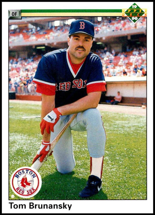 A Boston Red Sox player Tom Brunansky kneeling with a bat on his baseball card