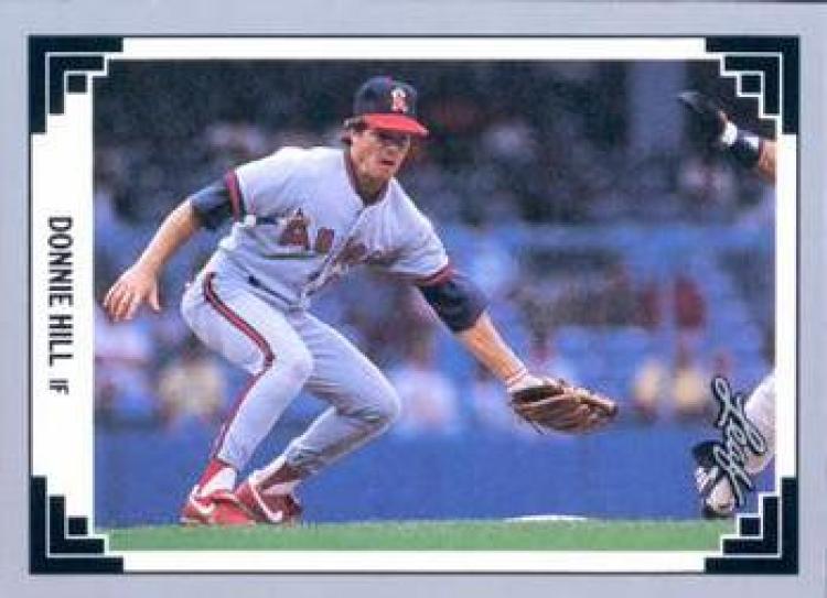 Donnie Hill fielding a ground ball in California Angels uniform on baseball card