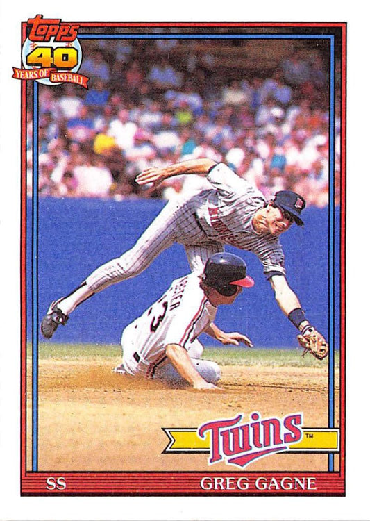 Baseball card of Greg Gagne leaping over a sliding baserunner for the Minnesota Twins