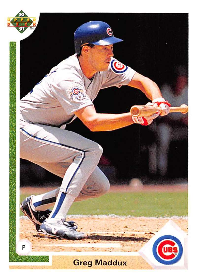 Greg Maddux in a bunt stance at home plate for Chicago Cubs baseball card