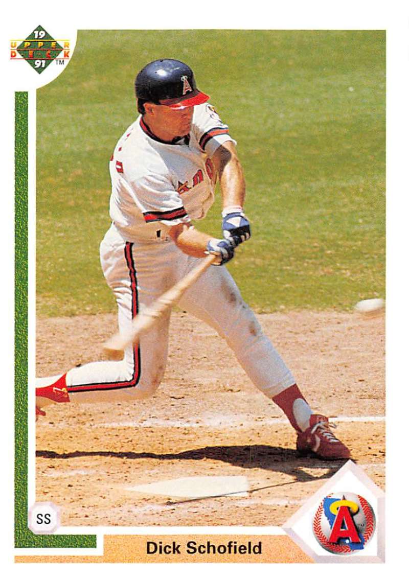 Dick Schofield swinging a bat at home plate on a California Angels baseball card