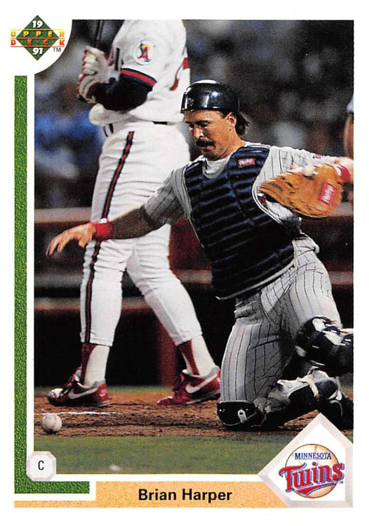 Baseball card of Brian Harper catching for Minnesota Twins by Upper Deck in action