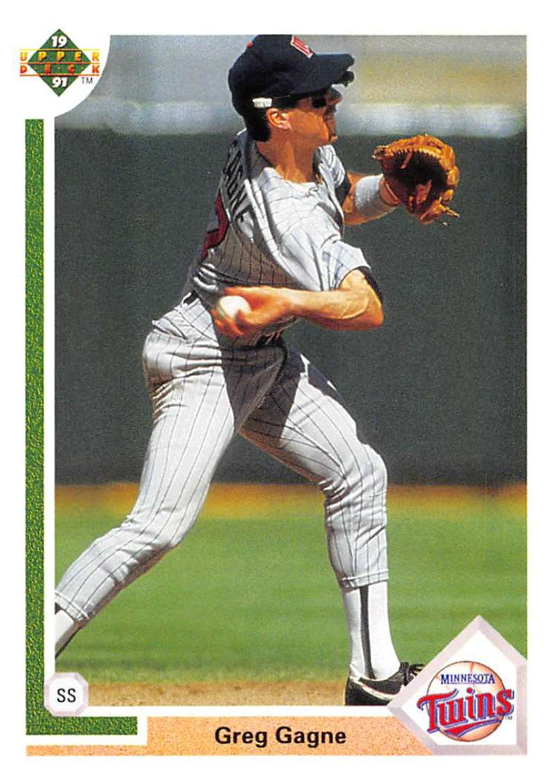 A Minnesota Twins player Greg Gagne fields a ball in his Upper Deck uniform