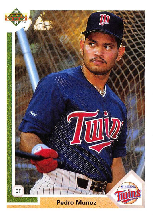 Baseball card of Pedro Munoz, Minnesota Twins player in navy uniform, Upper Deck