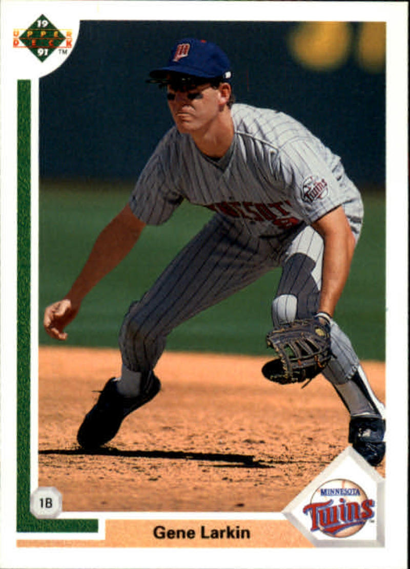 Gene Larkin fielding at first base in a Minnesota Twins pinstriped uniform baseball card