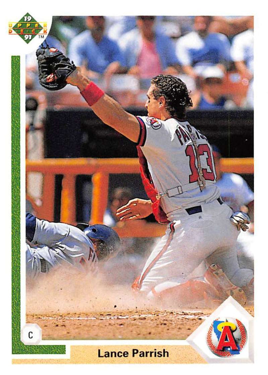 Lance Parrish sliding into home plate in California Angels uniform on baseball card