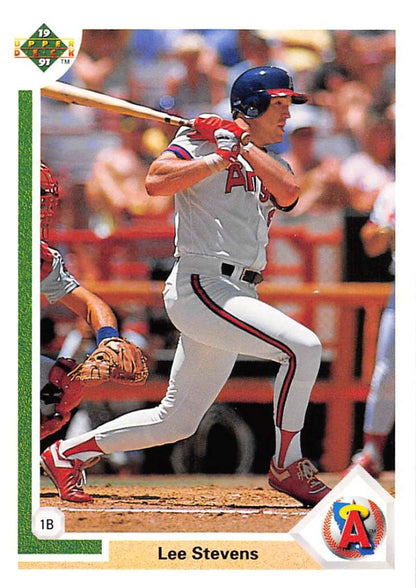 Lee Stevens in a white and red uniform swinging a bat on Upper Deck baseball card