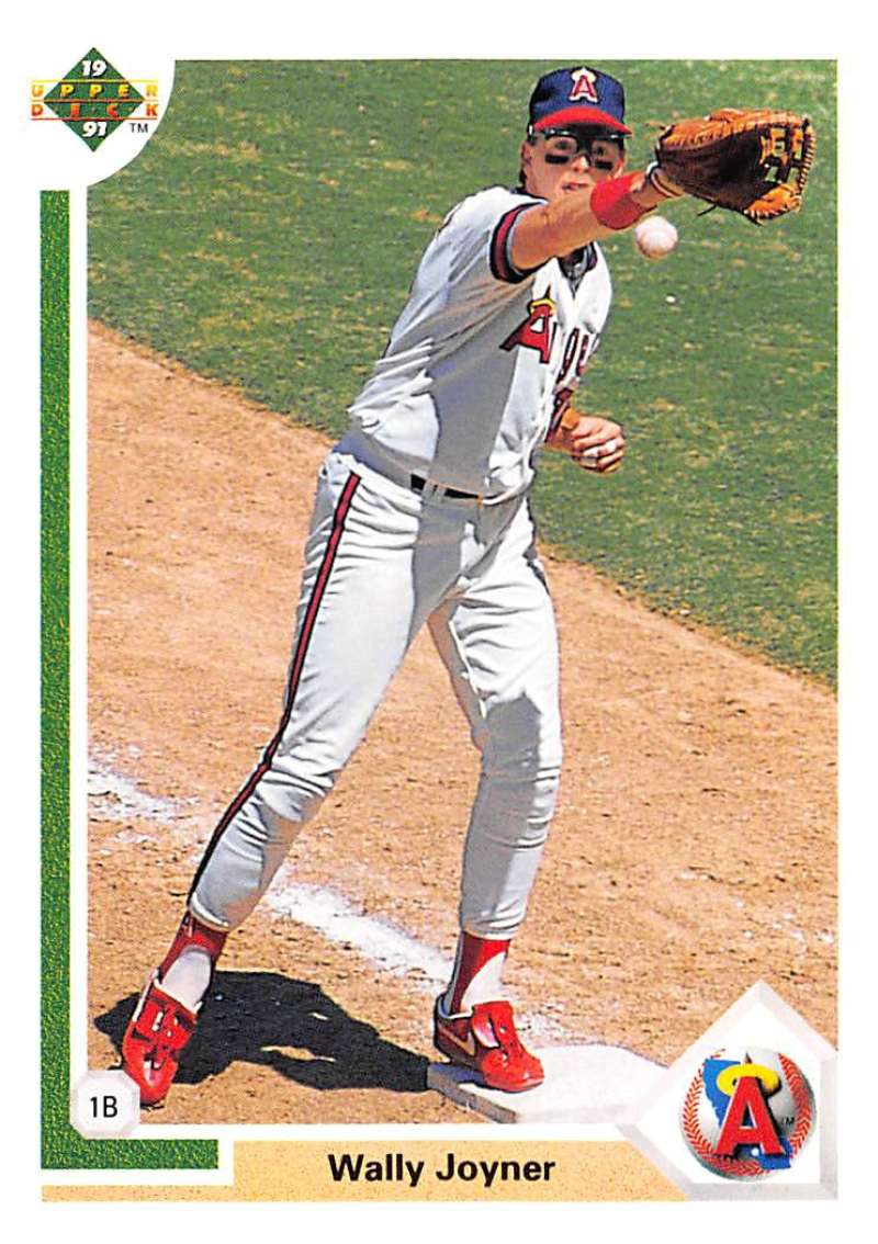 Baseball player in white uniform catching a ball, Wally Joyner California Angels Baseball Card