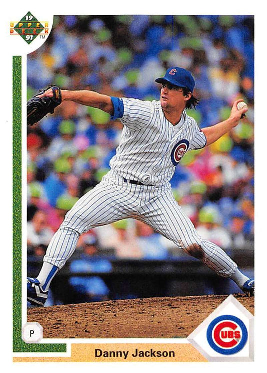 Chicago Cubs pitcher Danny Jackson mid-delivery in white pinstriped uniform