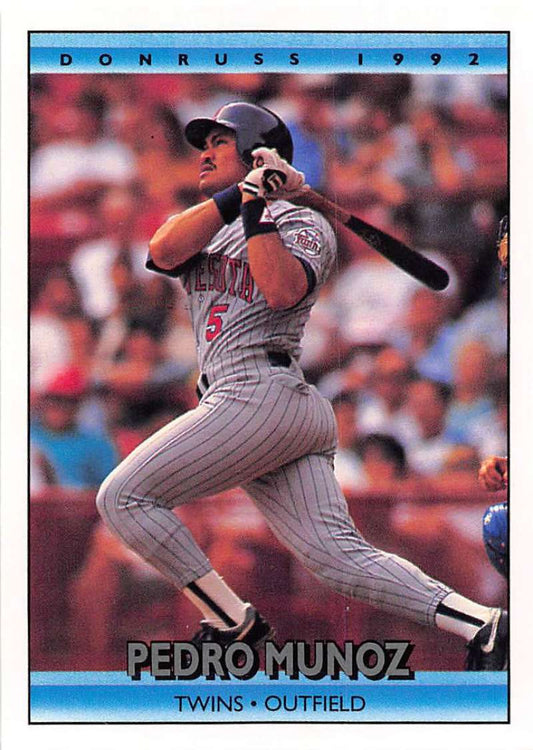 1992 Donruss baseball card of Pedro Munoz in pinstriped Minnesota Twins uniform at bat