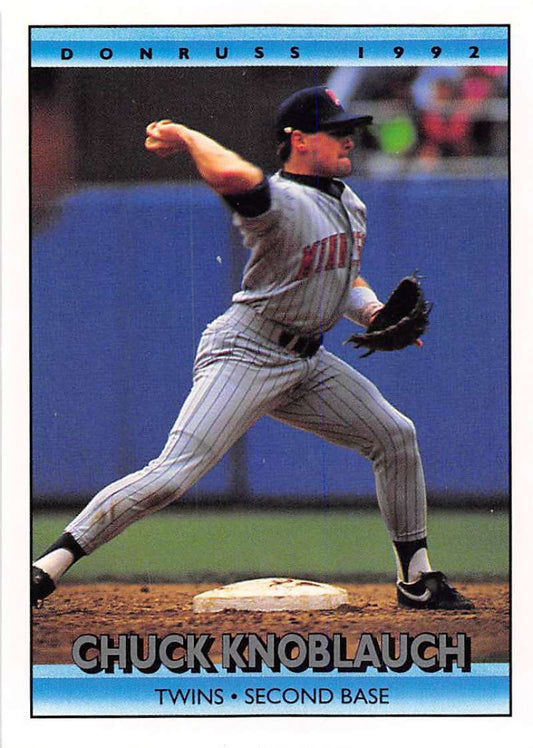 Baseball player in Minnesota Twins uniform throwing ball on Chuck Knoblauch card