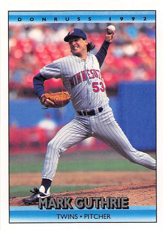 Mark Guthrie delivering a pitch in Minnesota Twins uniform on baseball card