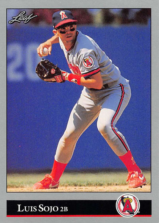 Luis Sojo fielding in gray uniform and red socks on 1992 Leaf California Angels card