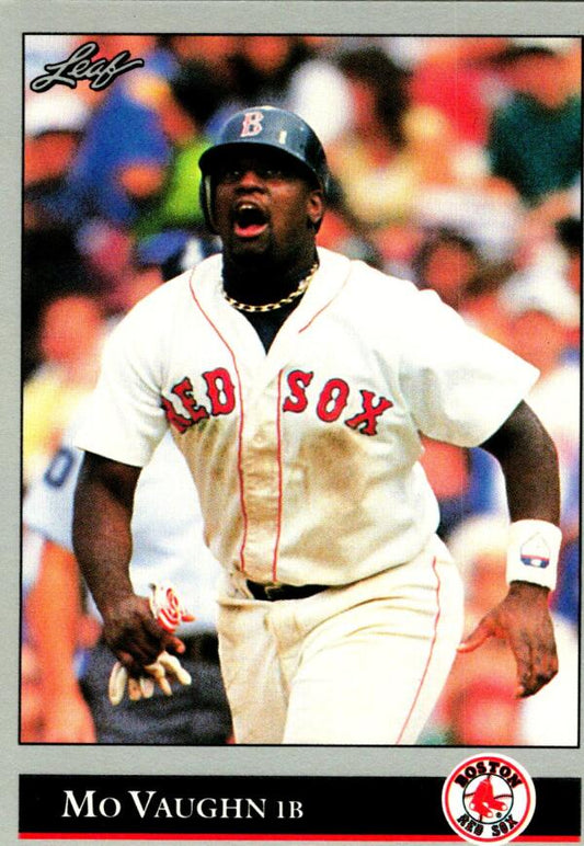 Baseball player in white Boston Red Sox uniform showing emotion during game action