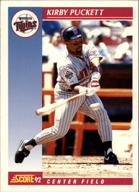 Minnesota Twins baseball player Kirby Puckett swinging bat in pinstriped uniform