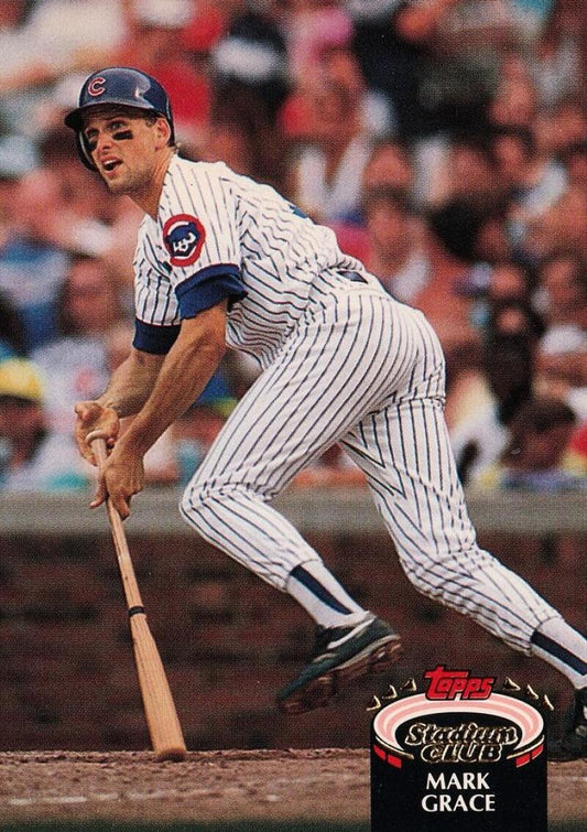 Mark Grace in Chicago Cubs pinstripes swinging, featured on a baseball card