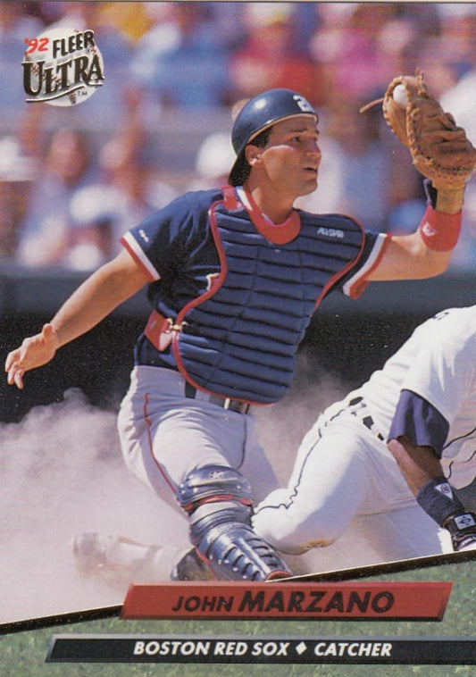 Baseball card of John Marzano, Red Sox catcher in navy uniform at home plate