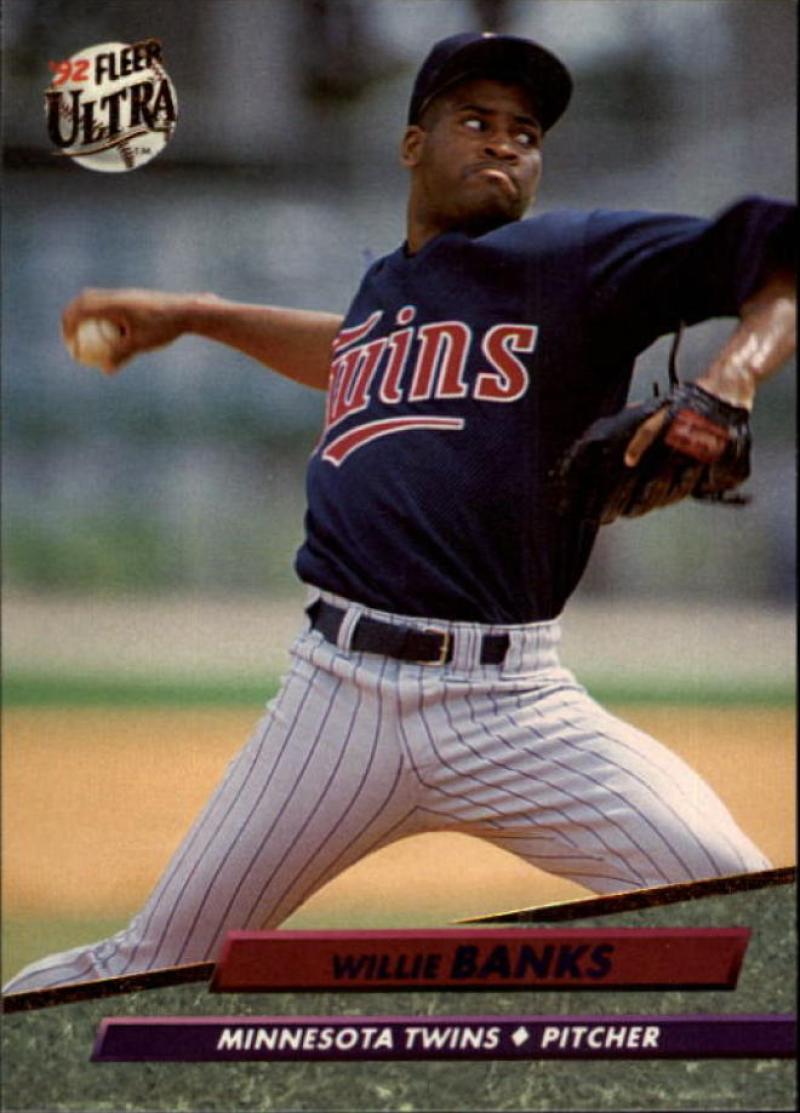 Willie Banks of the Minnesota Twins mid-pitch in a navy pinstriped uniform