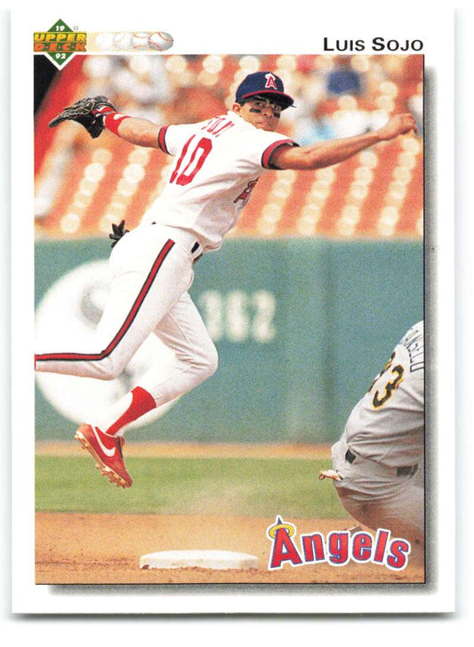 Baseball player makes a defensive leap in an Angels uniform on a Luis Sojo baseball card