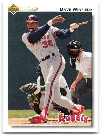 Baseball player Dave Winfield in California Angels uniform swinging at home plate