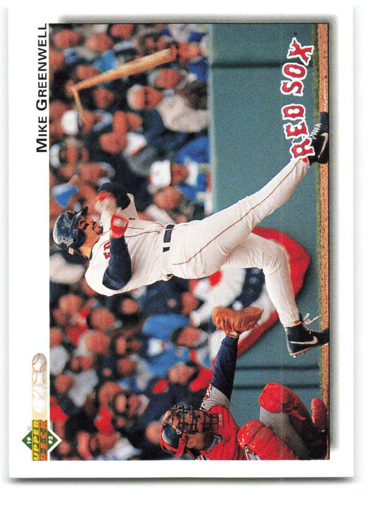 Baseball card featuring Mike Greenwell making a leaping catch in Red Sox uniform