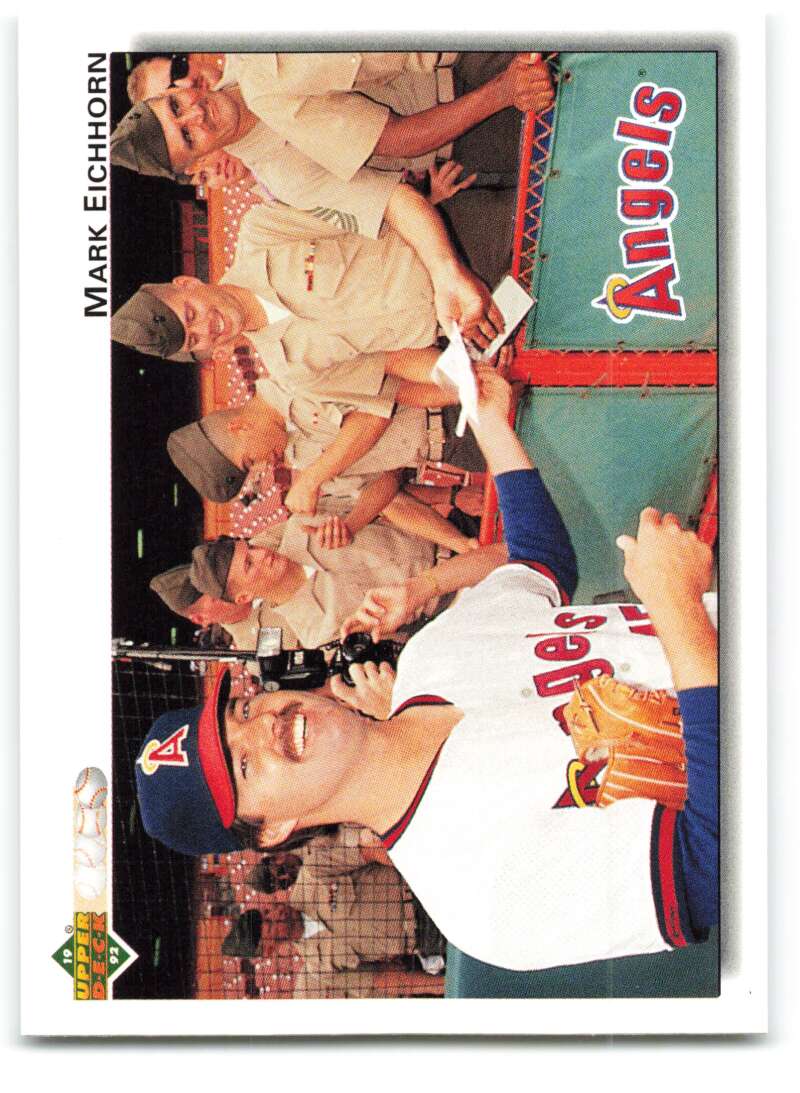 Baseball card of Mark Eichhorn celebrating with California Angels teammates in the dugout