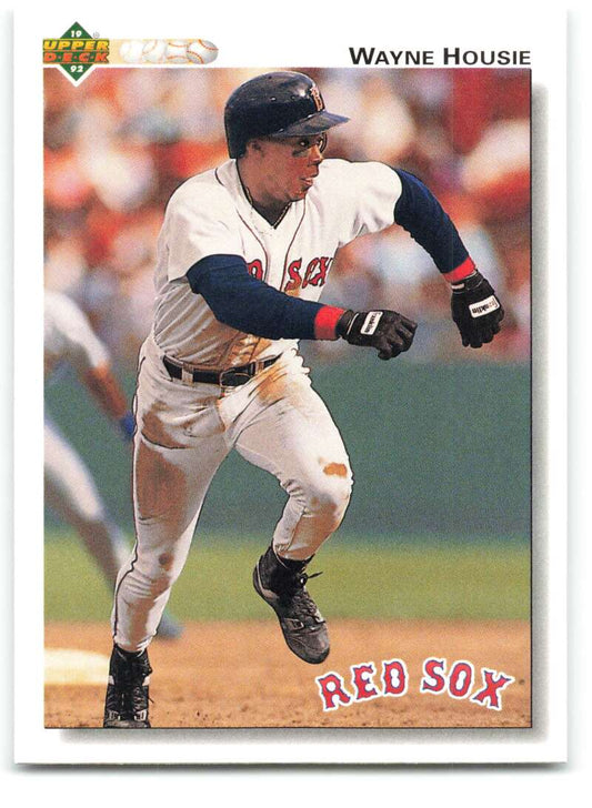 Baseball player in a Boston Red Sox uniform running on the field for 1992 Upper Deck card