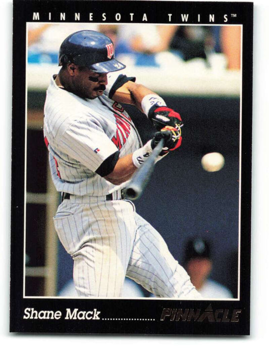 Shane Mack swinging bat in white pinstriped uniform for Minnesota Twins baseball card