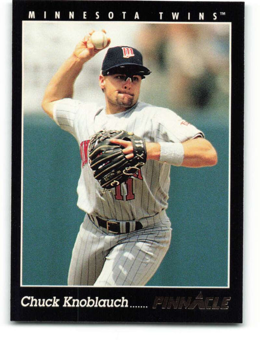 Minnesota Twins player Chuck Knoblauch in white uniform throwing ball on baseball card